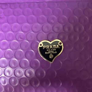 Prada Heart-Shaped Logo Accessory.